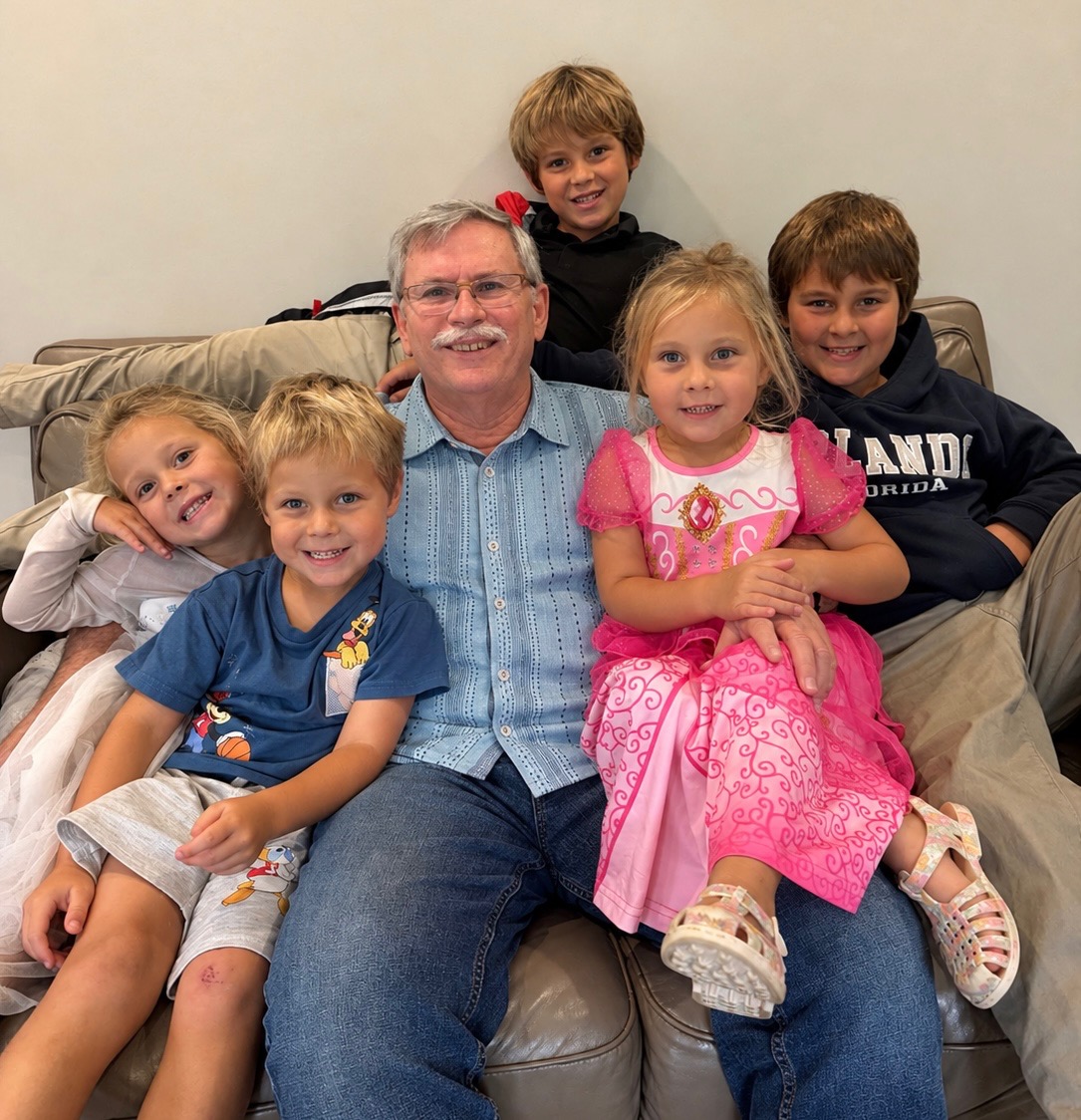 Dr. Jeff Deaton with children whose families he helped through fertility care
